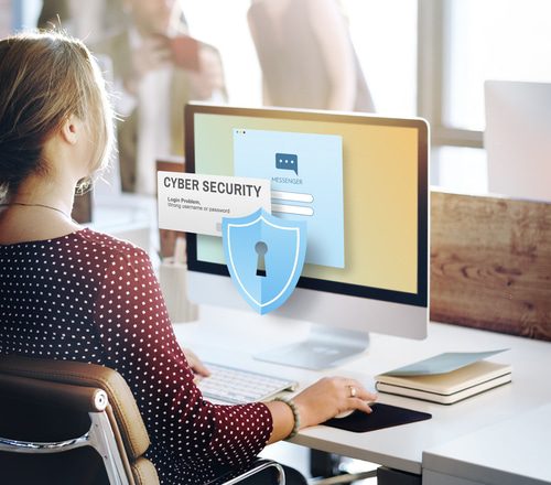 woman using computer to learn about cybersecurity