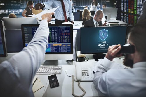 people working at computers at desk