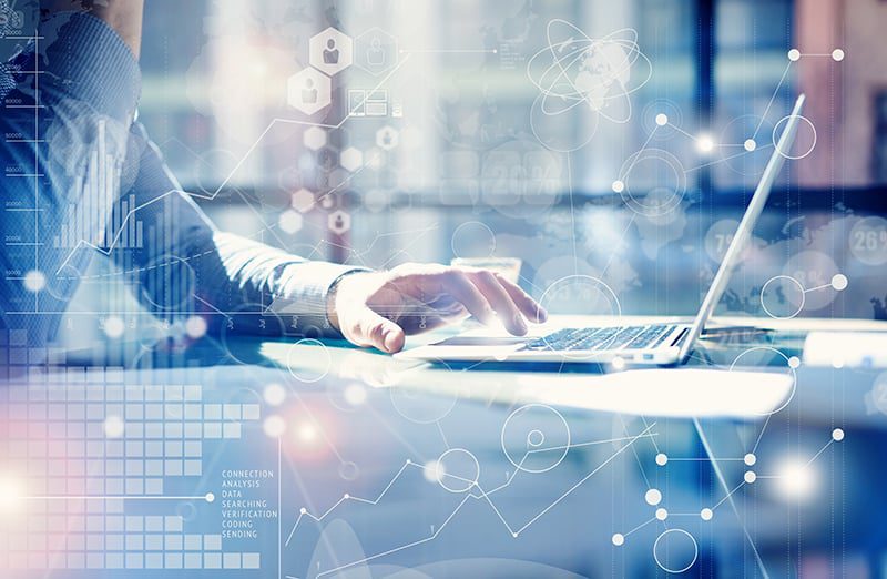 businessman using laptop at desk. overlay of lines and shapes over the image