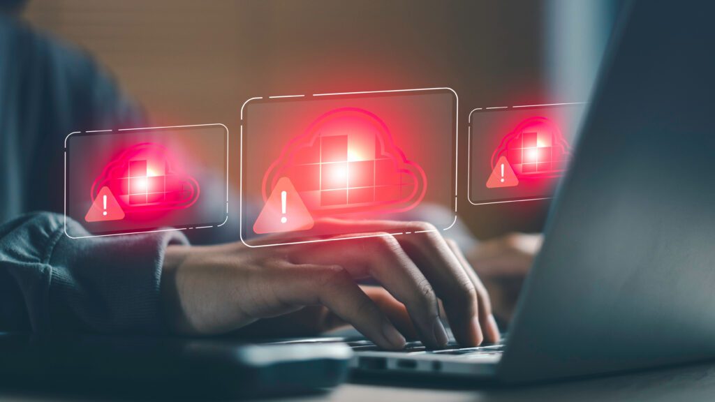 Cloud outage and service disruption concept with warning alerts on cloud interface, Infrastructure failure, application downtime, incident response, and business continuity management on laptop.How to Prevent Large-Scale IT Outages
