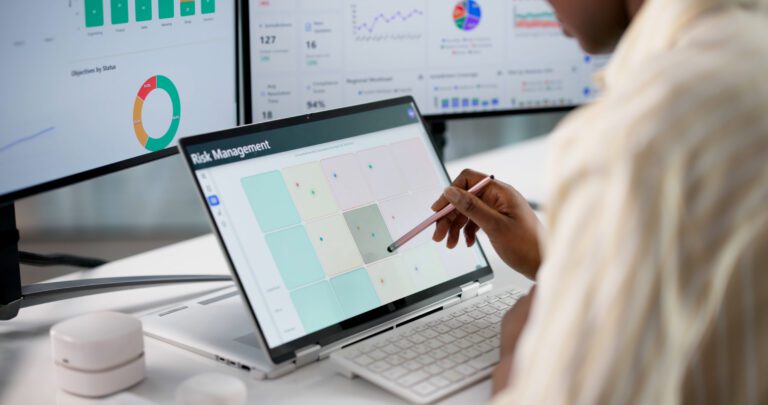 emale Risk Analyst Building Strategic Solutions On Laptop For Business